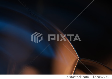 Green liquid surface, green and blue reflections of liquid in macro,, bubbles in macro, connection of bubbles in macro, cell from liquid, dark background, glossy surface 127837240