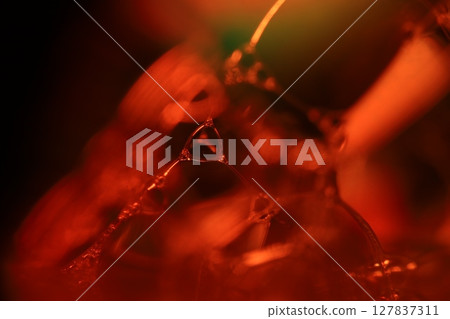 Oil production, brown bubbles in macro, texture of viscous black liquid, oil in laboratory 127837311