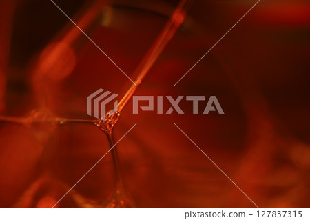 Oil production, brown bubbles in macro, texture of viscous black liquid, oil in laboratory Oil production, brown bubbles in macro, texture of viscous black liquid, oil in laboratory 127837315