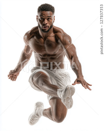 Muscular Hispanic male handball player leaps with power and agility 127837353