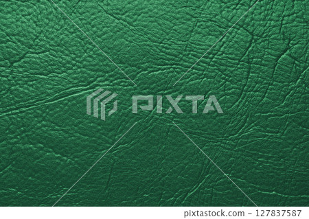Close up, macro texture of green glossy natural genuine leather, leatherette structure Close up, macro texture of green glossy natural genuine leather, leatherette structure 127837587