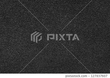 Grainy texture of black colored asphalt, plaster, cement, plastic close up, macro background 127837607