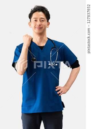 Male medical staff doing a fist pump Male medical staff doing a fist pump 127837652