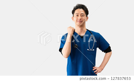 Male medical staff doing a fist pump Male medical staff doing a fist pump 127837653