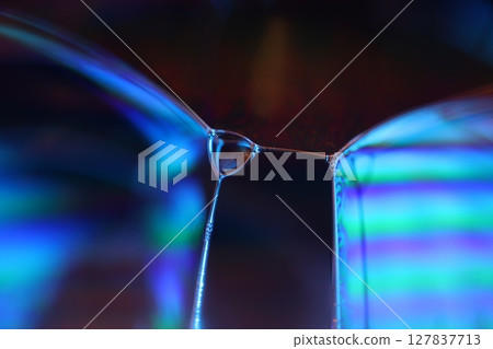 Bright blue liquid surface on black background, oil stains movement, bright chemistry, surreal background, blue sky colour, connection lines, water waves Bright blue liquid surface on black background, oil stains movement, bright chemistry, surreal background, blue sky colour, connection lines, water waves 127837713