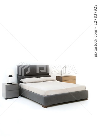A bed with a grey headboard and a white sheet 127837925