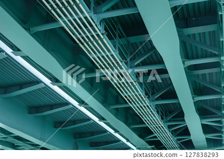 view from below of the bridge supporting beams, close up of steel structure view from below of the bridge supporting beams, close up of steel structure 127838293