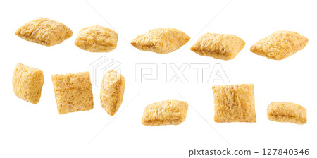 Tasty corn pillows isolated on white background . 127840346