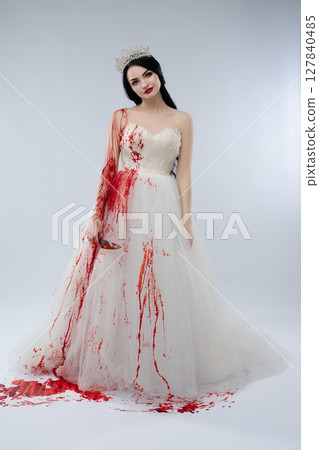 Bride in white gown stained with blood holding knife, embodying a dark fantasy Bride in white gown stained with blood holding knife, embodying a dark fantasy 127840485