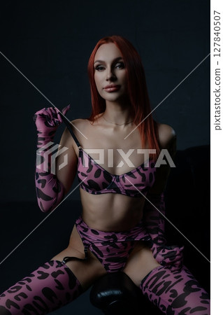 Couple enjoys intimate moment with woman in seductive lingerie and striking pose 127840507