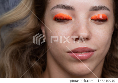 Caucasian woman undergoing eyelash lamination procedure. top view.  127840950