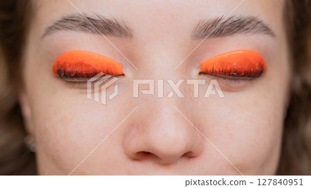 Caucasian woman undergoing eyelash lamination procedure. top view. Caucasian woman undergoing eyelash lamination procedure. top view. 127840951