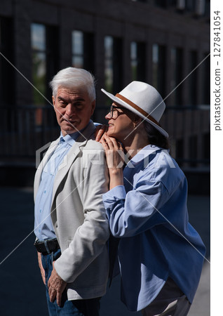 Mature couple walking around the city and sightseeing.  127841054
