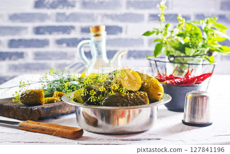 picled cucumber in metal bowl 127841196