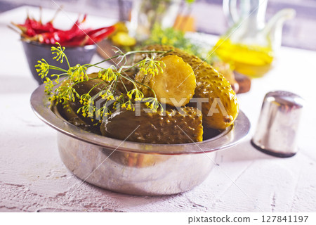 picled cucumber in metal bowl 127841197