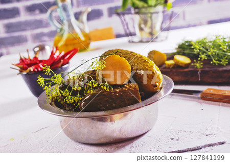 picled cucumber in metal bowl 127841199