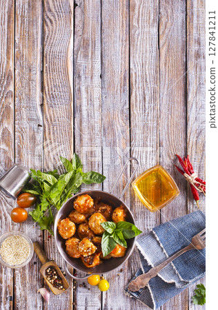 Meat meatballs with spices, sauce and garlic. Top view, copy space. Meat meatballs with spices, sauce and garlic. Top view, copy space. 127841211