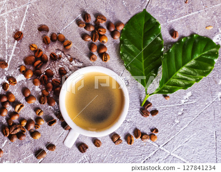 Coffee cup and coffee beans on gray background, Black coffee cup aromatic 127841234