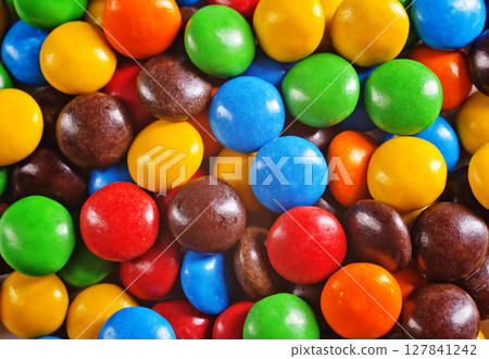Multi-colored sweet candies (confectionery) of different colors. 127841242