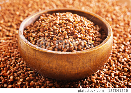 Close up raw buckwheat background. Close up raw buckwheat background. 127841256