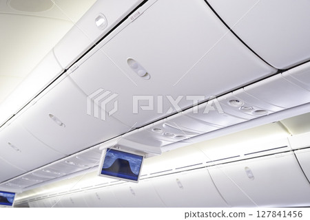 Baggage storage space on airplanes 127841456