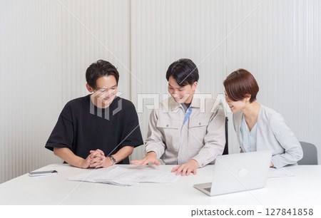 Construction workers having a meeting Construction workers having a meeting 127841858