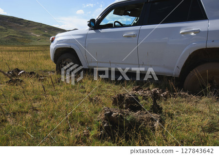 Offroad car got stuck in the mud 127843642