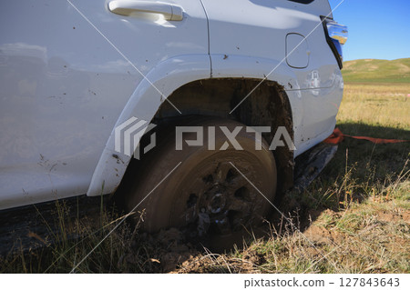 Offroad car got stuck in the mud Offroad car got stuck in the mud 127843643