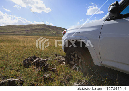 Offroad car got stuck in the mud 127843644