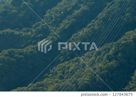 Aerial view of electricity transit on mountains 127843675