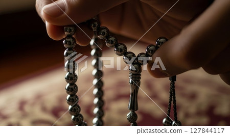 Close Up of Black Prayer Beads Held in Hands Rosary Meditation Concept	 127844117