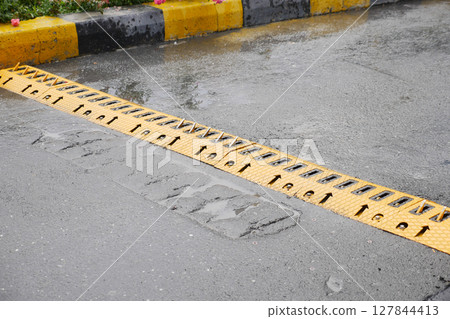 Promoting Road Safety Importance of Yellow Speed Bump During Rainy Conditions Promoting Road Safety Importance of Yellow Speed Bump During Rainy Conditions 127844413