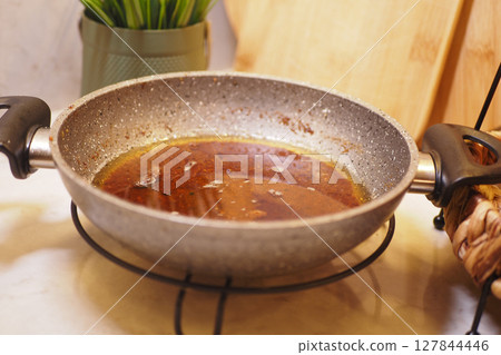 used cooking oil in frying pan. used cooking oil in frying pan. 127844446