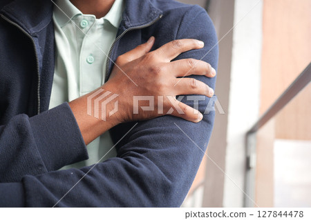 Person Holding Arm in Pain Demonstrating Joint Discomfort or Injury Person Holding Arm in Pain Demonstrating Joint Discomfort or Injury 127844478