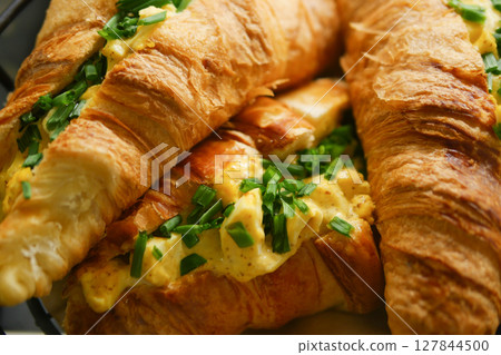 Delicious Savory Croissant Sandwiches Filled with Egg and Fresh Herbs Delicious Savory Croissant Sandwiches Filled with Egg and Fresh Herbs 127844500