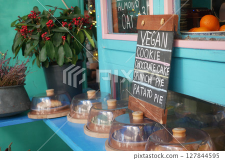Vegan dessert display at a cozy cafe in the afternoon Vegan dessert display at a cozy cafe in the afternoon 127844595