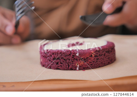 Delicious red velvet cake served on a wooden table 127844614