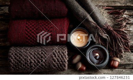 Cozy Autumn Still Life with Knitted Scarves and Candles 127846231
