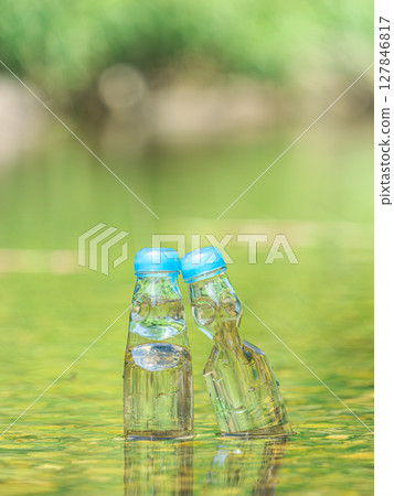 Two bottles of Ramune cooled with cold river water - Summer vacation Two bottles of Ramune cooled with cold river water - Summer vacation 127846817