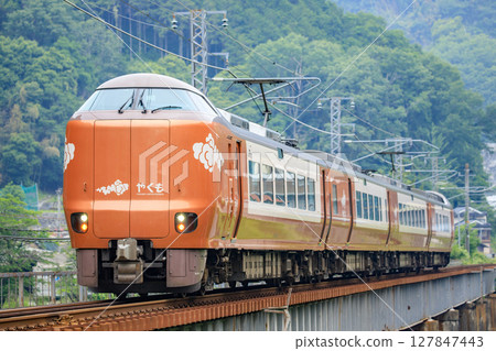 Limited Express "Yakumo" (JR West 273 series) crossing the 7th Takahashigawa Bridge Limited Express "Yakumo" (JR West 273 series) crossing the 7th Takahashigawa Bridge 127847443