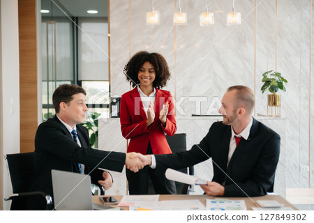 business people shaking hands during a meeting in office 127849302