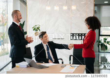 business people shaking hands during a meeting in office 127849303