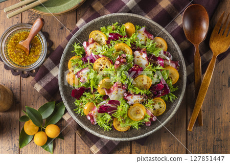 Octopus and kumquat salad 127851447