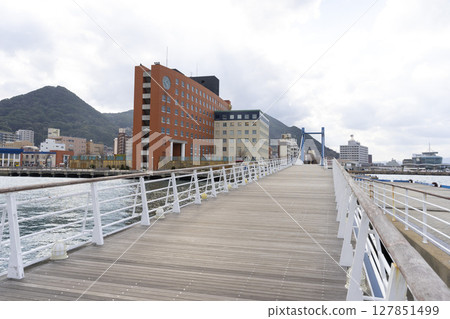 Kitakyushu, Japan - Dec 29,2022 : Blue Wing Moji Bridge in Mojiko Retro Area in Kitakyushu, Japan on Dec 29,2022. 127851499