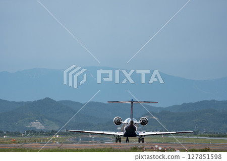 Sendai Airport at dusk, airplane taking off, Natori City, Miyagi Prefecture Sendai Airport at dusk, airplane taking off, Natori City, Miyagi Prefecture 127851598