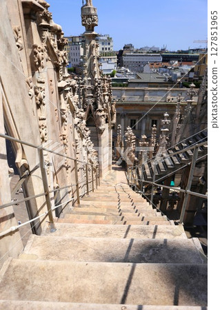 Terrace steps and spires of the Duomo of Milan 127851965