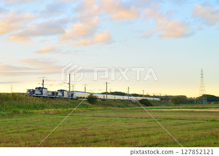 The Cassiopeia sleeper express train runs through the twilight land towards Honshu. The Cassiopeia sleeper express train runs through the twilight land towards Honshu. 127852121