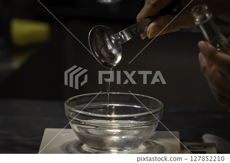Making a cake_Pouring kirsch 127852210