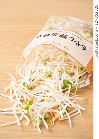 Bags of bean sprouts, pea sprouts, carrots, and onions 127852520