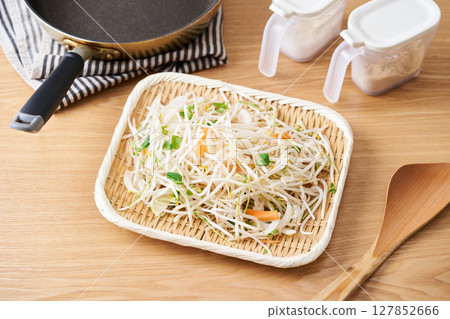 Cut vegetables arranged in a colander. Bean sprouts, pea sprouts, carrots, onions 127852666
